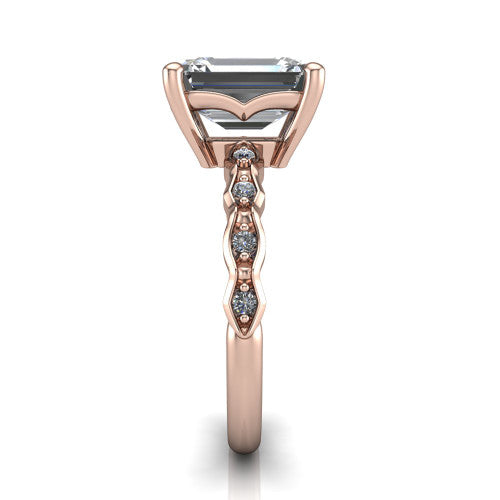 Cassie emerald vintage station engagement ring in 14K Rose Gold with marquise milgrain band and bezel accents, side profile showing the marquise station band and bezel accents