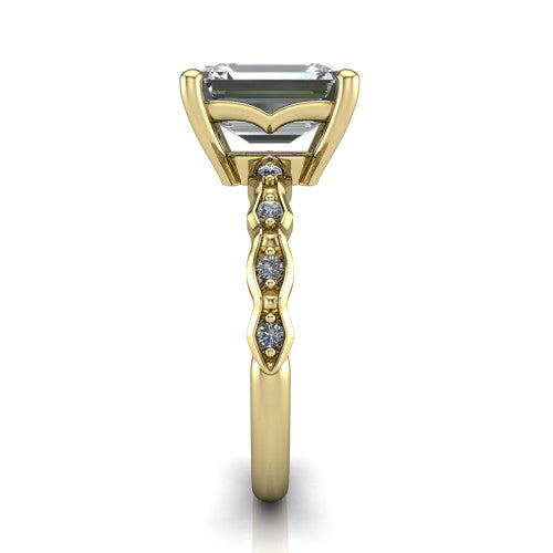Cassie emerald vintage station engagement ring in 14K Yellow Gold with marquise milgrain band and bezel accents, side profile showing the marquise station band and bezel accents