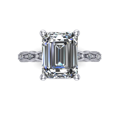 Cassie emerald vintage station engagement ring in Platinum with marquise milgrain band and bezel accents, top-down view of the four-prong center and station band