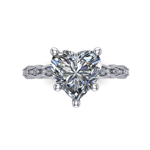 Cassie heart vintage station engagement ring in Platinum with marquise milgrain band and bezel accents, top-down view of the four-prong center and station band