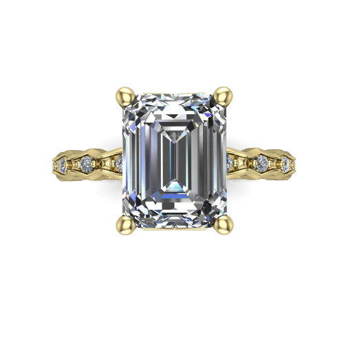 Cassie emerald vintage station engagement ring in 18K Yellow Gold with marquise milgrain band and bezel accents, top-down view of the four-prong center and station band
