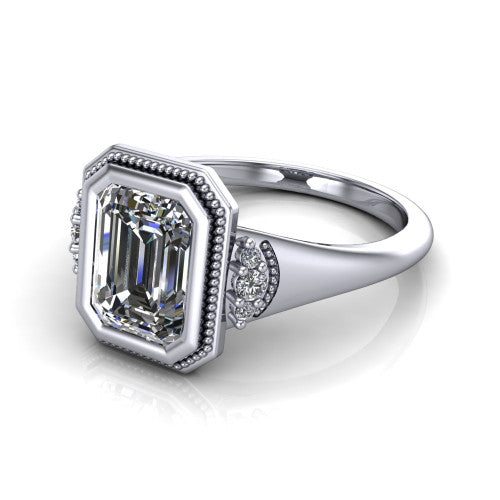 Elliana emerald bezel-set solitaire engagement ring in 14K White Gold with squared milgrain bezel and pavé shoulders, three-quarter perspective view