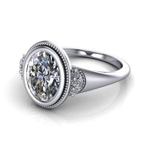 Elliana oval bezel-set solitaire engagement ring in 18K White Gold with squared milgrain bezel and pavé shoulders, three-quarter perspective view