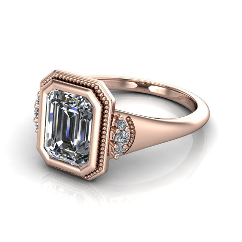 Elliana emerald bezel-set solitaire engagement ring in 18K Rose Gold with squared milgrain bezel and pavé shoulders, three-quarter perspective view