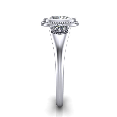 Elliana cushion bezel-set solitaire engagement ring in Platinum with squared milgrain bezel and pavé shoulders, side profile showing the milgrain bezel and split gallery