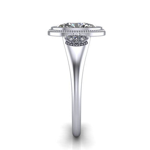 Elliana oval bezel-set solitaire engagement ring in Platinum with squared milgrain bezel and pavé shoulders, side profile showing the milgrain bezel and split gallery