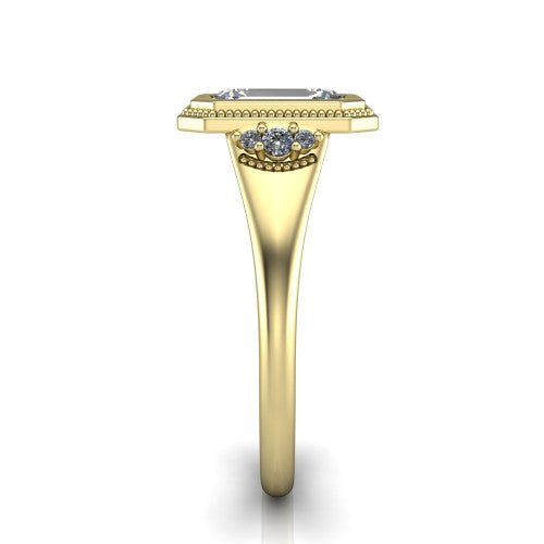 Elliana emerald bezel-set solitaire engagement ring in 18K Yellow Gold with squared milgrain bezel and pavé shoulders, side profile showing the milgrain bezel and split gallery