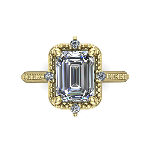 Esther emerald vintage halo engagement ring in 14K Yellow Gold with squared milgrain halo and corner points, top-down view of the squared halo and corner points