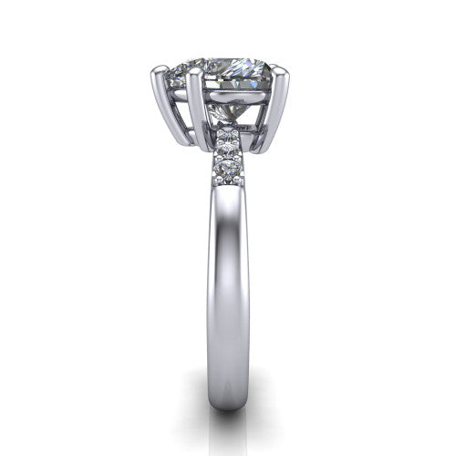 Rebecca heart solitaire engagement ring in Platinum with pavé shoulder accents, side profile showing the pavé shoulders and plain band