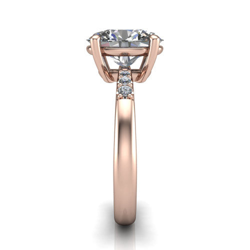 Rebecca oval solitaire engagement ring in 14K Rose Gold with pavé shoulder accents, side profile showing the pavé shoulders and plain band
