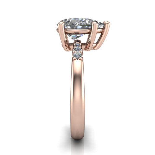 Rebecca pear solitaire engagement ring in 14K Rose Gold with pavé shoulder accents, side profile showing the pavé shoulders and plain band