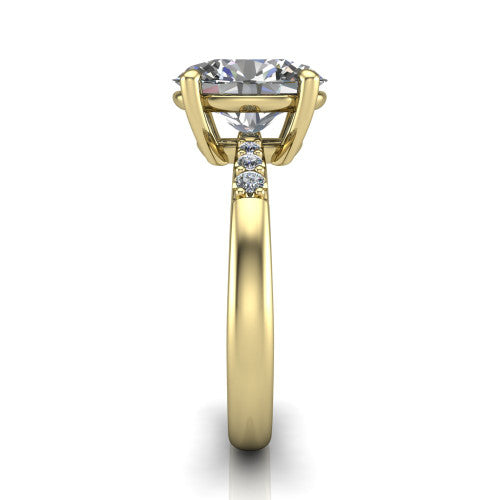 Rebecca oval solitaire engagement ring in 14K Yellow Gold with pavé shoulder accents, side profile showing the pavé shoulders and plain band