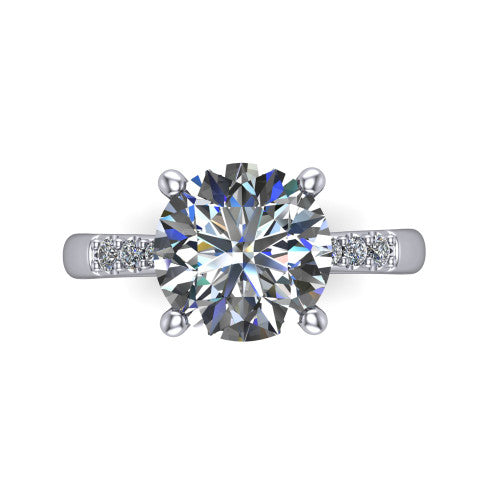 Rebecca round solitaire engagement ring in 18K White Gold with pavé shoulder accents, top-down view of the four-prong center and pavé shoulders