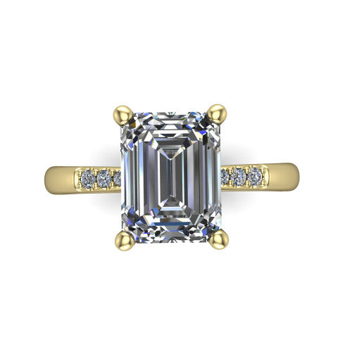 Rebecca emerald solitaire engagement ring in 14K Yellow Gold with pavé shoulder accents, top-down view of the four-prong center and pavé shoulders