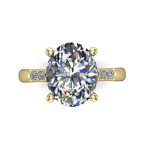 Rebecca oval solitaire engagement ring in 18K Yellow Gold with pavé shoulder accents, top-down view of the four-prong center and pavé shoulders