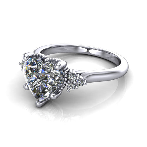Brianna heart three stone engagement ring in 18K White Gold with milgrain-framed center and round side clusters, three-quarter perspective view