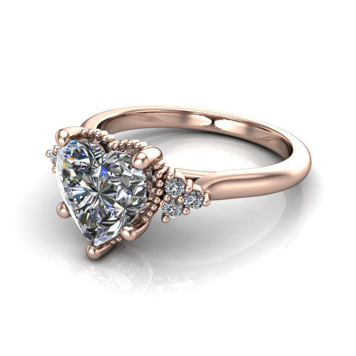 Brianna heart three stone engagement ring in 14K Rose Gold with milgrain-framed center and round side clusters, three-quarter perspective view