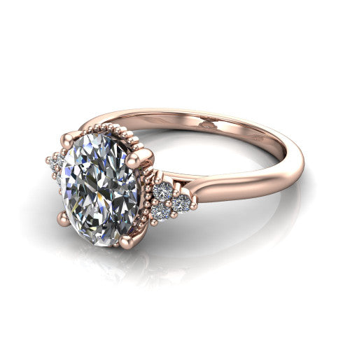 Brianna oval three stone engagement ring in 14K Rose Gold with milgrain-framed center and round side clusters, three-quarter perspective view