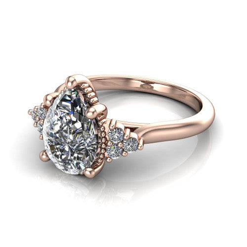 Brianna pear three stone engagement ring in 14K Rose Gold with milgrain-framed center and round side clusters, three-quarter perspective view