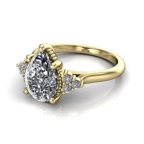 Brianna pear three stone engagement ring in 14K Yellow Gold with milgrain-framed center and round side clusters, three-quarter perspective view