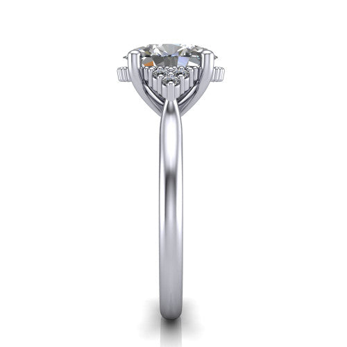 Brianna oval three stone engagement ring in 18K White Gold with milgrain-framed center and round side clusters, side profile showing the plain band and side accent clusters