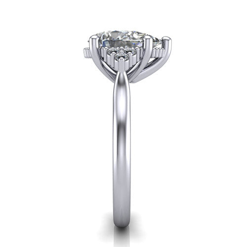 Brianna pear three stone engagement ring in Platinum with milgrain-framed center and round side clusters, side profile showing the plain band and side accent clusters