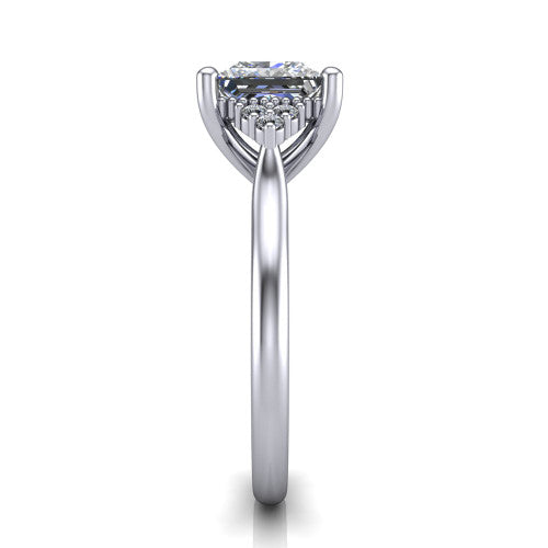 Brianna princess three stone engagement ring in 18K White Gold with milgrain-framed center and round side clusters, side profile showing the plain band and side accent clusters