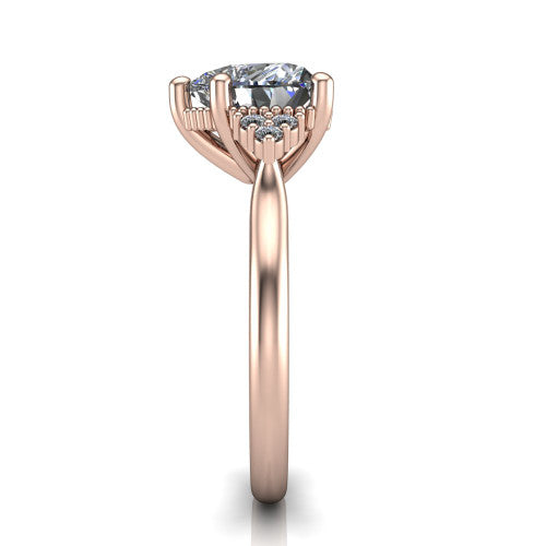 Brianna heart three stone engagement ring in 18K Rose Gold with milgrain-framed center and round side clusters, side profile showing the plain band and side accent clusters
