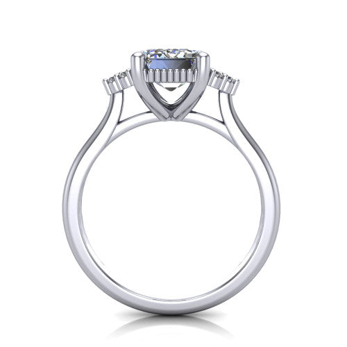 Brianna emerald three stone engagement ring in 18K White Gold with milgrain-framed center and round side clusters, through-finger front profile