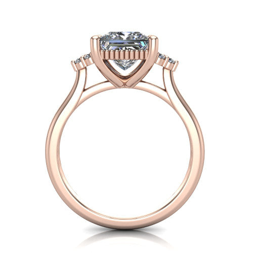 Brianna princess three stone engagement ring in 18K Rose Gold with milgrain-framed center and round side clusters, through-finger front profile