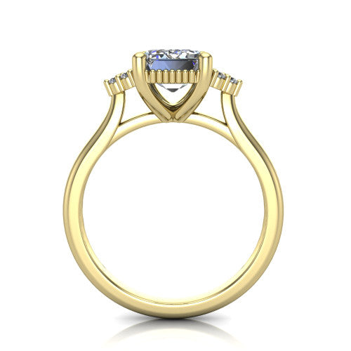 Brianna emerald three stone engagement ring in 14K Yellow Gold with milgrain-framed center and round side clusters, through-finger front profile