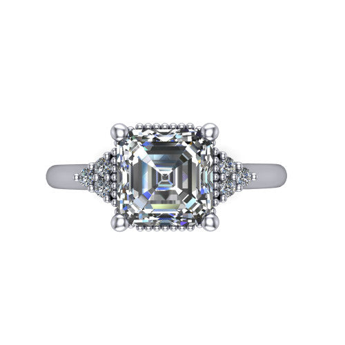 Brianna asscher three stone engagement ring in 18K White Gold with milgrain-framed center and round side clusters, top-down view of the milgrain-framed center and side accent clusters