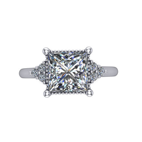 Brianna princess three stone engagement ring in 18K White Gold with milgrain-framed center and round side clusters, top-down view of the milgrain-framed center and side accent clusters