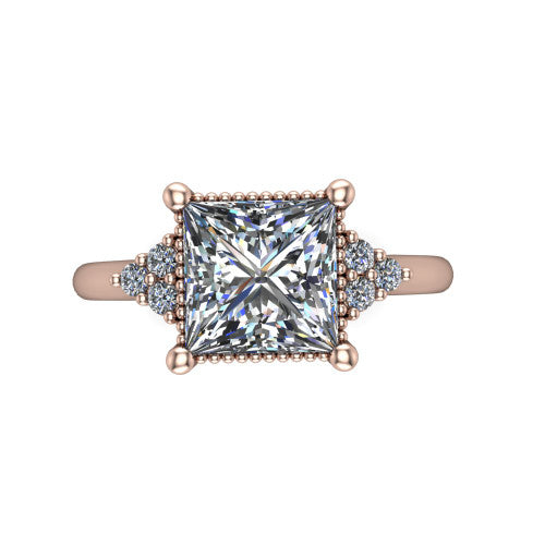 Brianna princess three stone engagement ring in 14K Rose Gold with milgrain-framed center and round side clusters, top-down view of the milgrain-framed center and side accent clusters