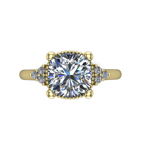 Brianna cushion three stone engagement ring in 14K Yellow Gold with milgrain-framed center and round side clusters, top-down view of the milgrain-framed center and side accent clusters