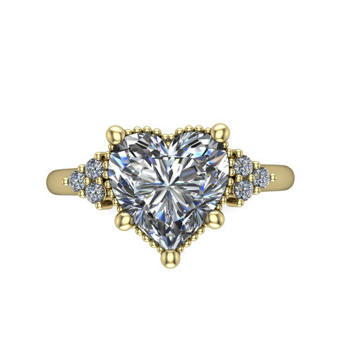 Brianna heart three stone engagement ring in 18K Yellow Gold with milgrain-framed center and round side clusters, top-down view of the milgrain-framed center and side accent clusters