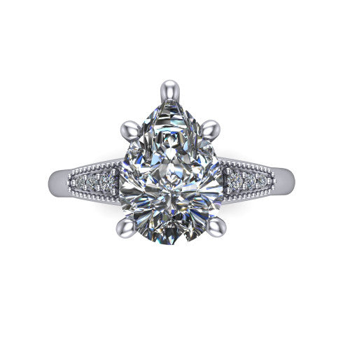 Juliette pear pavé solitaire engagement ring in 18K White Gold with milgrain-edged band, top-down view of the four-prong center and milgrain pavé band