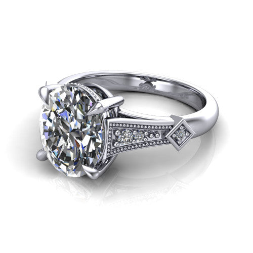 Emerson oval solitaire engagement ring in Platinum, three-quarter perspective showing the oval center diamond and kite-set accents on the milgrain band