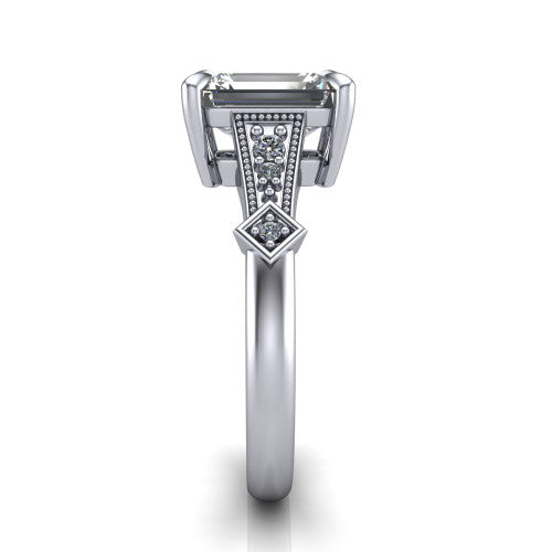 Emerson emerald-cut solitaire engagement ring in 18K White Gold, side profile showing the milgrain band, kite accents, and tapered profile in side view