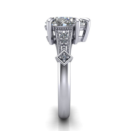 Emerson pear solitaire engagement ring in Platinum, side profile showing the milgrain band, kite accents, and tapered profile in side view