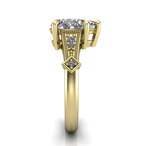 Emerson pear solitaire engagement ring in 14K Yellow Gold, side profile showing the milgrain band, kite accents, and tapered profile in side view