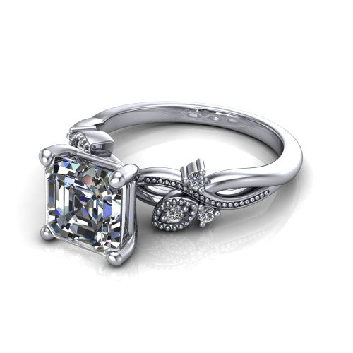 Ashley square emerald-cut solitaire engagement ring in 14K White Gold, three-quarter perspective showing the square emerald-cut center diamond above a milgrain leaf-and-vine band