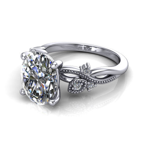 Ashley oval solitaire engagement ring in 14K White Gold, three-quarter perspective showing the oval center diamond above a milgrain leaf-and-vine band