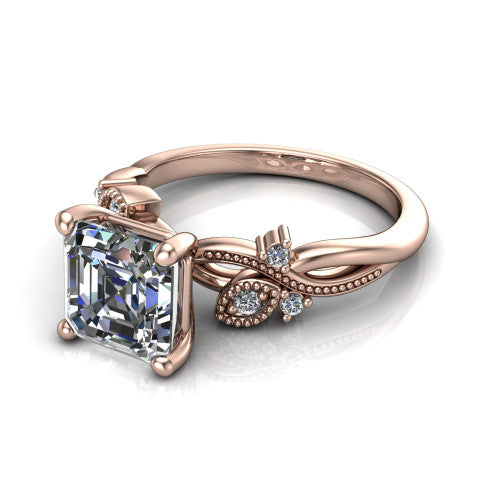 Ashley square emerald-cut solitaire engagement ring in 14K Rose Gold, three-quarter perspective showing the square emerald-cut center diamond above a milgrain leaf-and-vine band