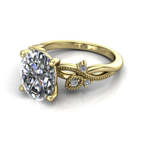 Ashley oval solitaire engagement ring in 14K Yellow Gold, three-quarter perspective showing the oval center diamond above a milgrain leaf-and-vine band