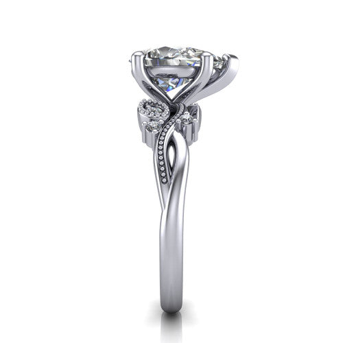 Ashley pear solitaire engagement ring in Platinum, side profile showing the leaf motif, diamond accents, and twisted band in side view