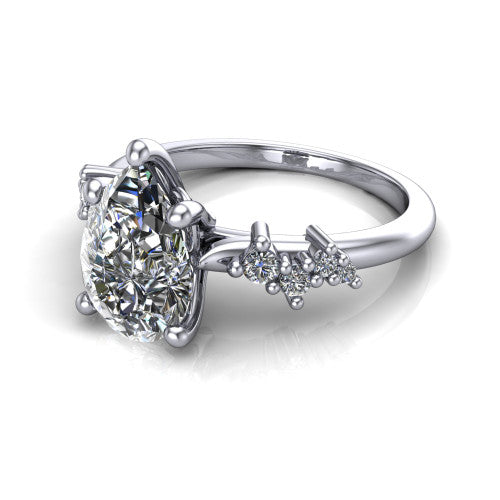 Georgia pear classic engagement ring in Platinum, three-quarter perspective showing the pear center diamond and scattered cluster accents on the band