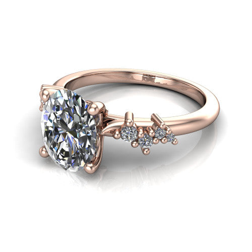 Georgia oval classic engagement ring in 14K Rose Gold, three-quarter perspective showing the oval center diamond and scattered cluster accents on the band