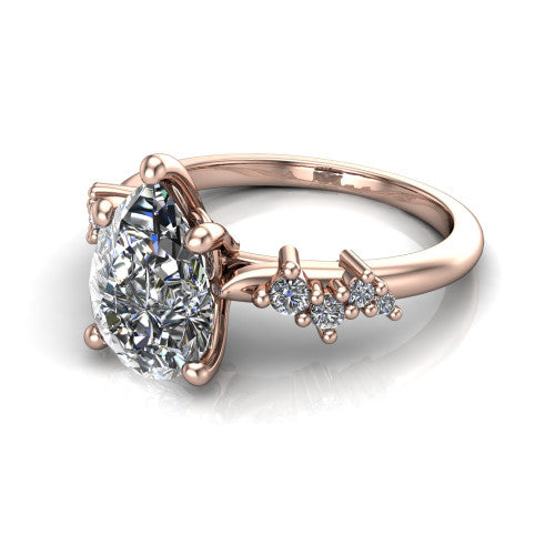 Georgia pear classic engagement ring in 14K Rose Gold, three-quarter perspective showing the pear center diamond and scattered cluster accents on the band
