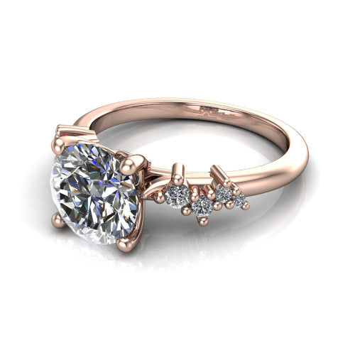 Georgia round classic engagement ring in 14K Rose Gold, three-quarter perspective showing the round center diamond and scattered cluster accents on the band